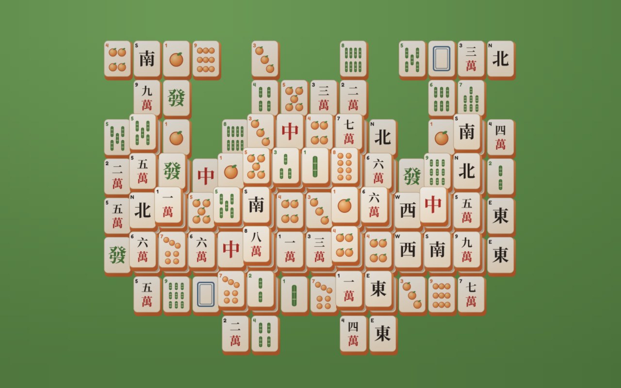 A mahjong solitaire board on green felt, with apricot, bamboo and character tiles